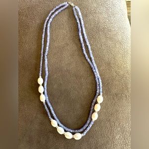 Women’s double loop pearl and lavender bead necklace.